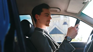 Driver looking ahead from inside a car